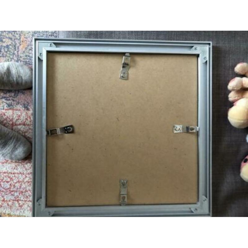 Fotolijst 30x30 met paspartoe van 12x12cm. RVS rand.