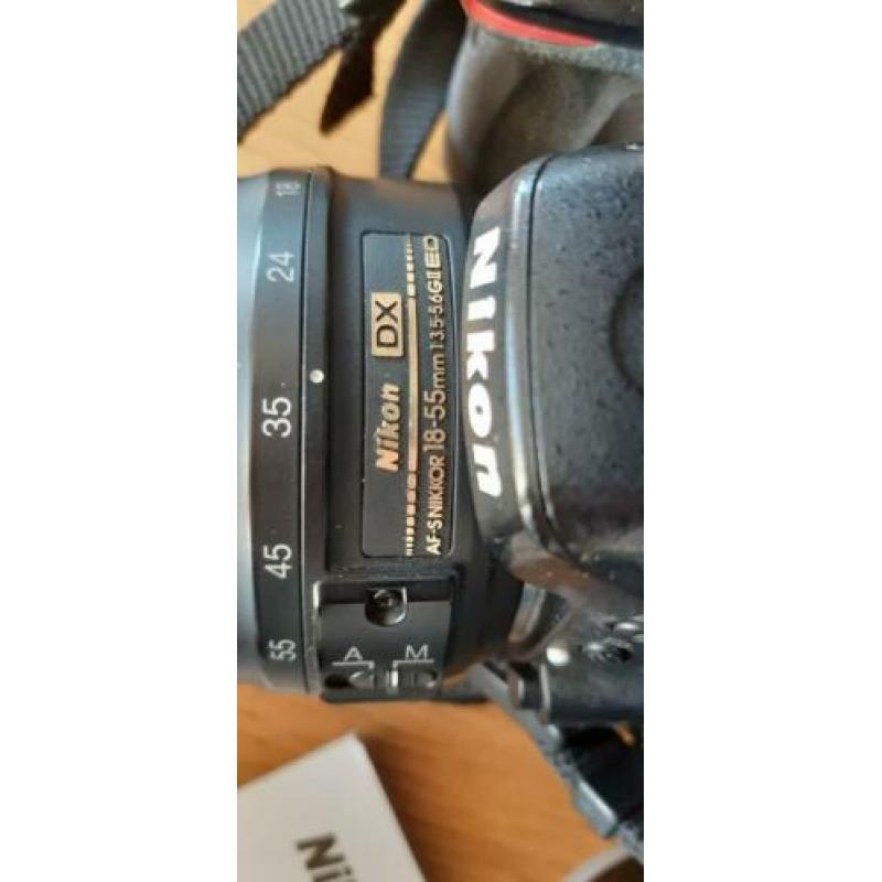 Nikon D5100 met 2 lenzen 18-55 en 55-200