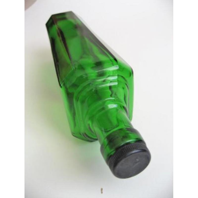 Oude groene art deco fles vlekkenwater
