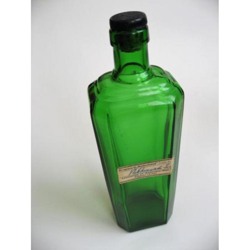 Oude groene art deco fles vlekkenwater